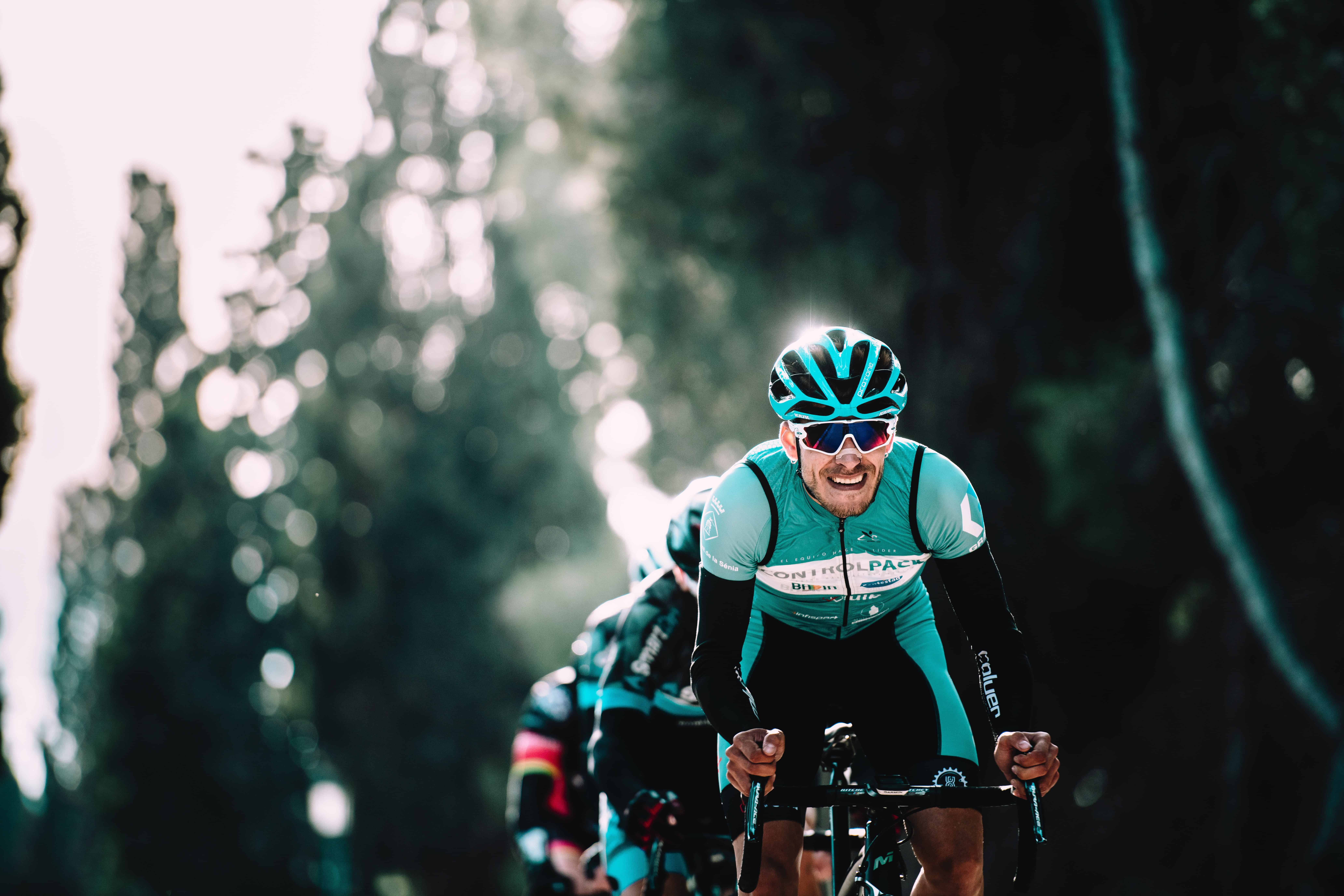 Cyclist in full gear racing outdoors